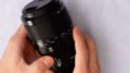 Sony FE 90mm f/2.8 Macro G OSS lens detail view showing aperture ring and weather-sealed black body