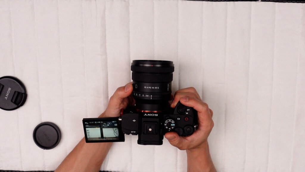 Sony 16-35 F4 PZ G lens side profile view showing Sony G branding and barrel control buttons