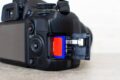 A high-end DSLR camera equipped with best V90 UHS-II SD cards for high-end cameras for optimal storage capacity.