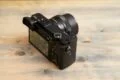 A Sony camera on top of a wooden platform.